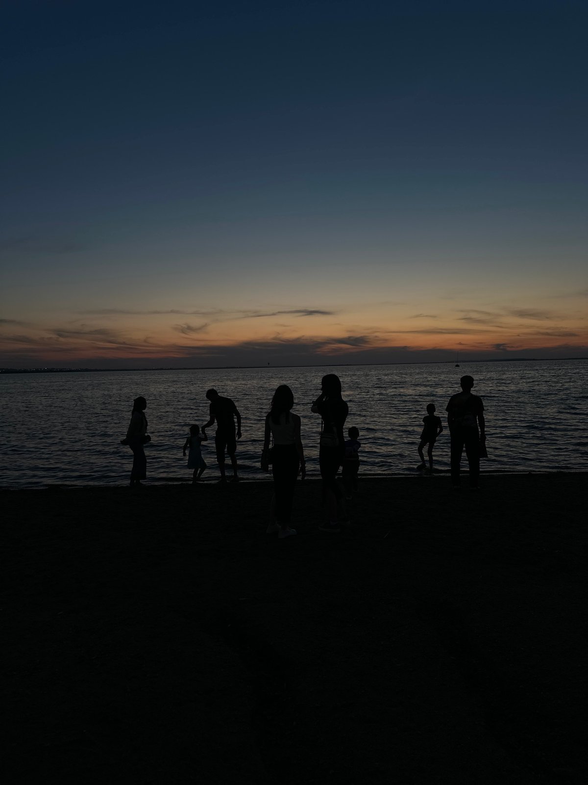 Dusk gathering at a Kazakhstan lakeshore