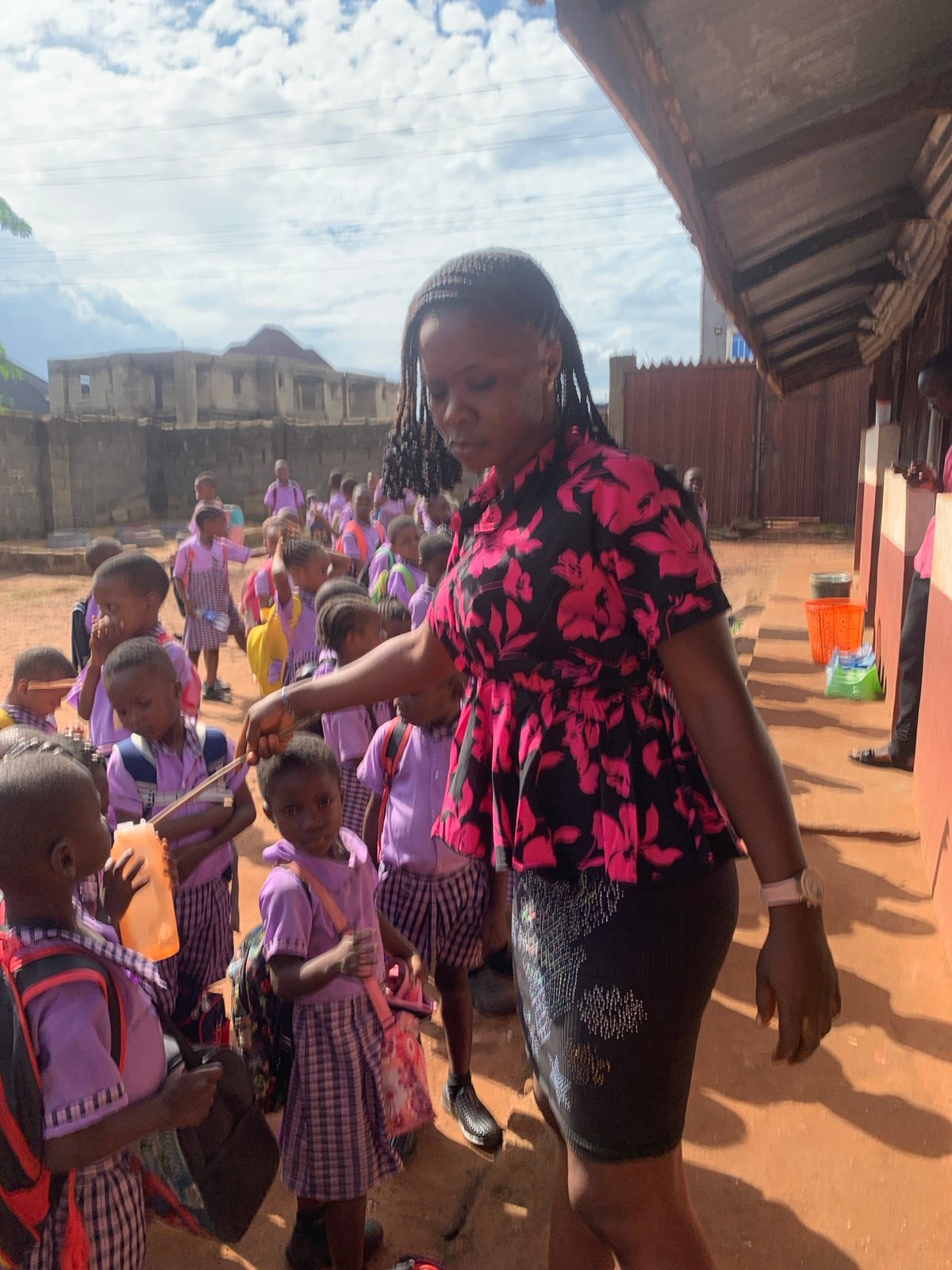 School children gather in courtyard during daytime in Nigeria