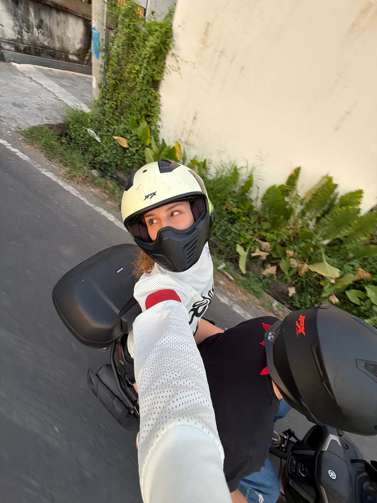 Motorcycle riders, cyclists captured in North Kuta sunset scenes