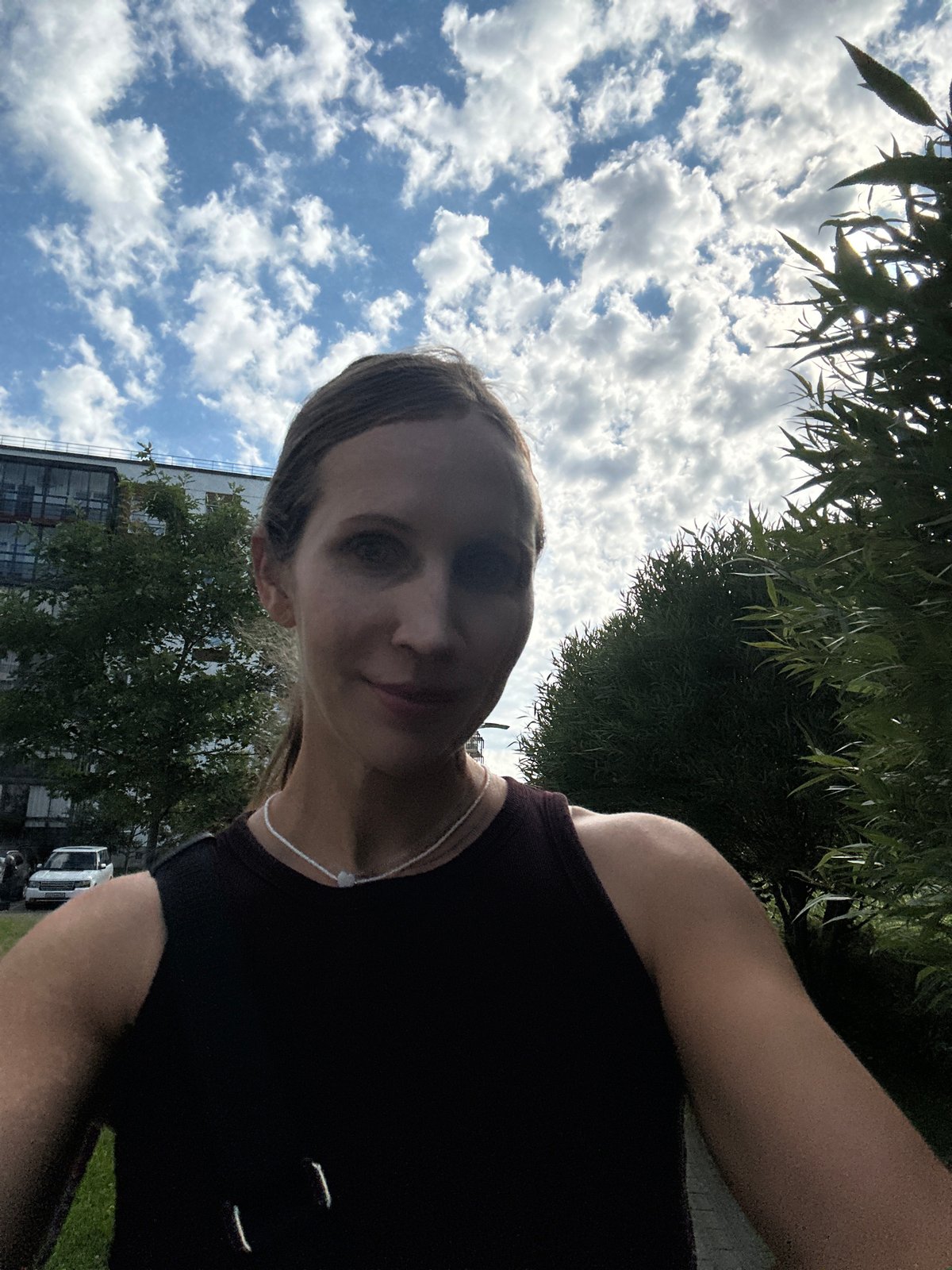 Sidewalk selfie outside a Vsevolozhsk apartment block