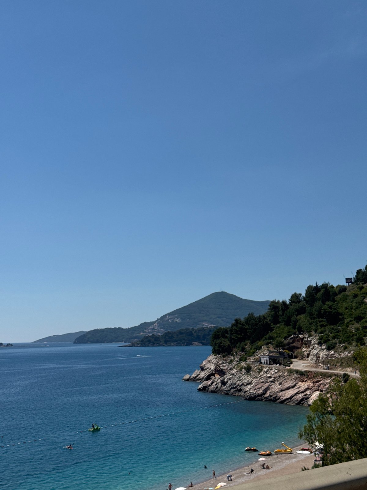 Aerial view captures Kamenovo beach's turquoise waters and cliffs