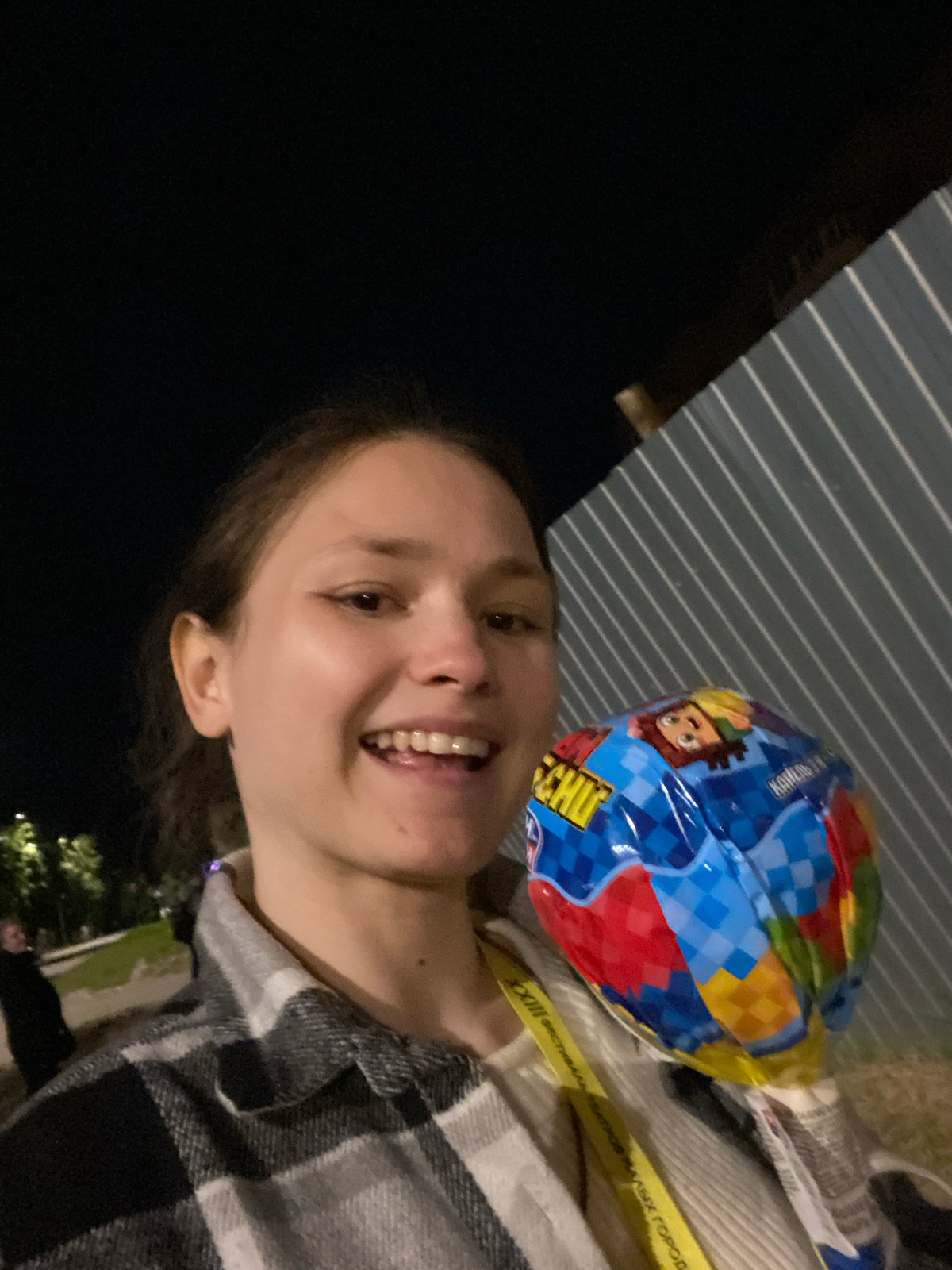 Woman poses with cartoon balloon in Peresvet, Russia