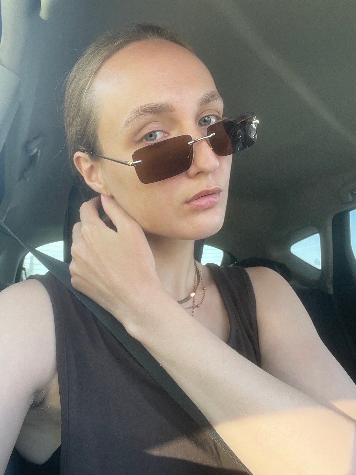 Woman in car, cityscape views captured in Izhevsk