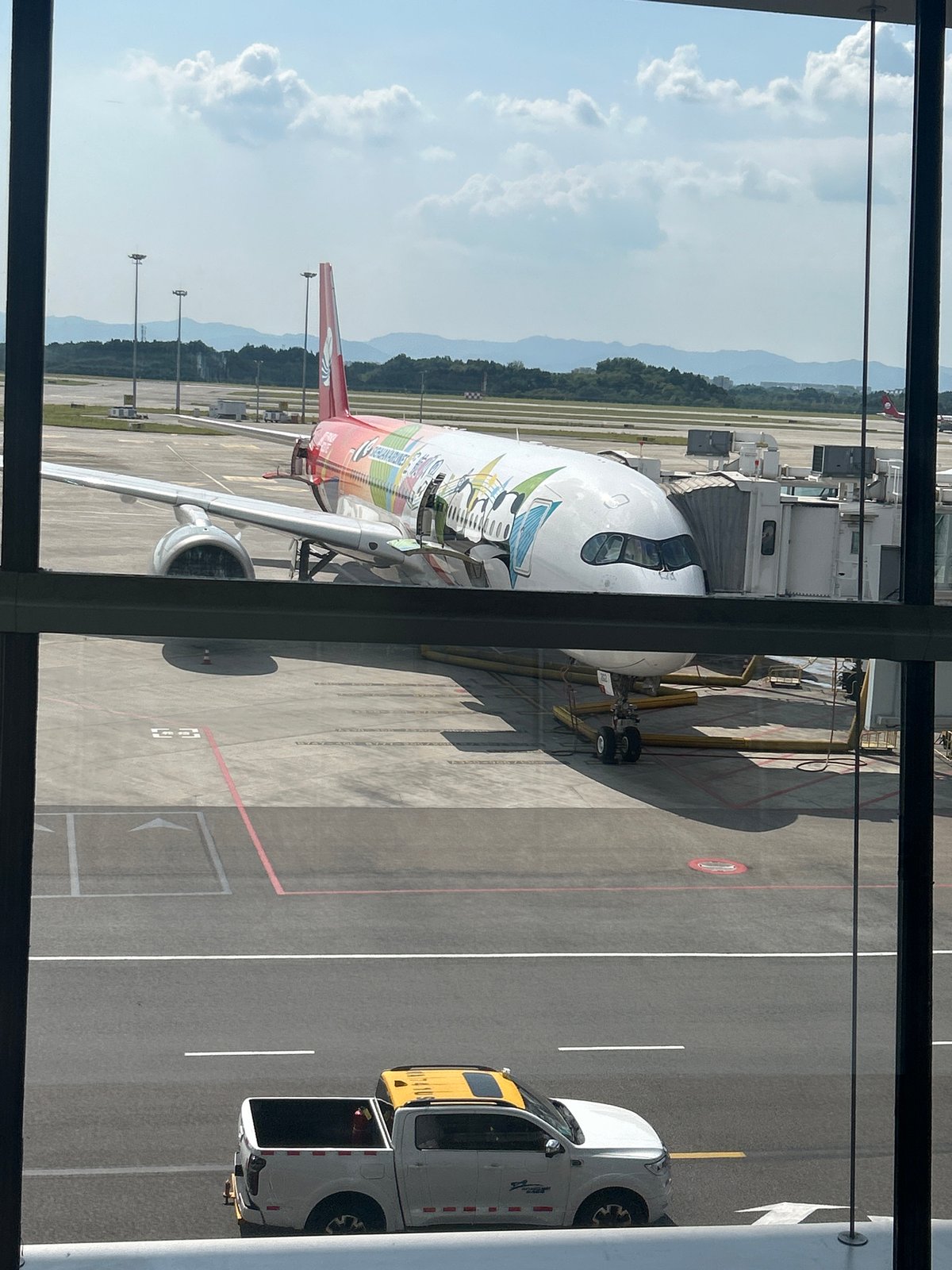 Morning at Jianyang Airport: terminal interiors and a cartoon-liveried plane