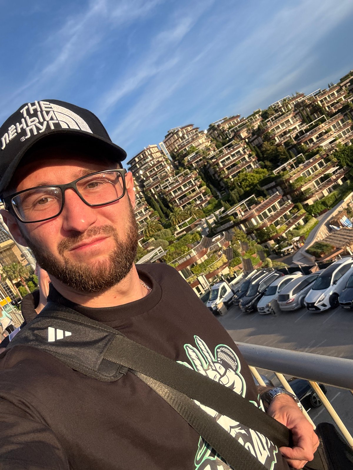 Man in North Face cap takes selfie