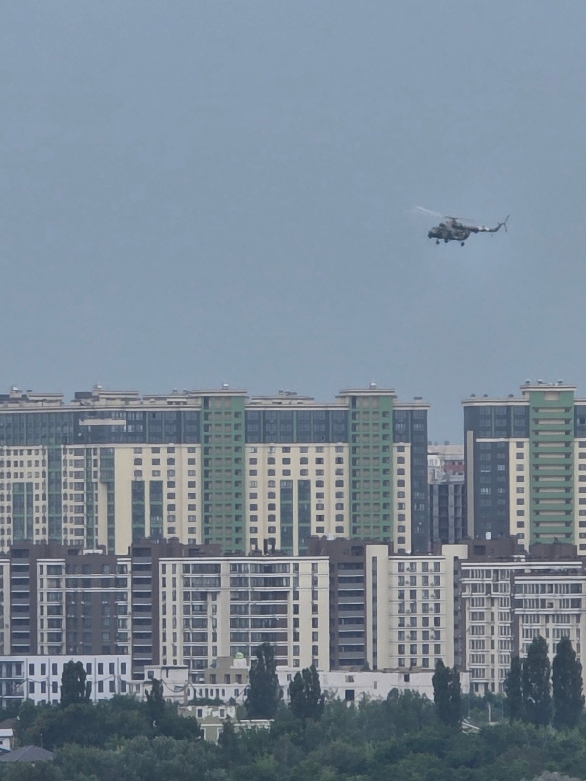 Military helicopter over Kyiv residential neighborhoods