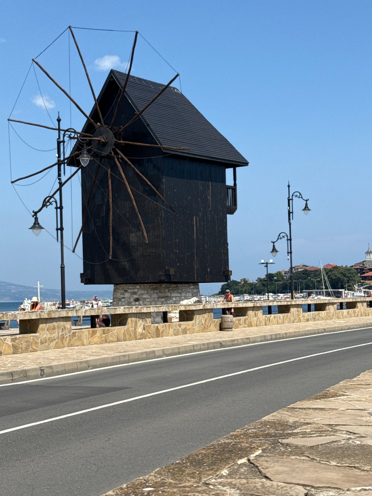 Nesebar waterfront: old windmill meets modern hotel on the Black Sea