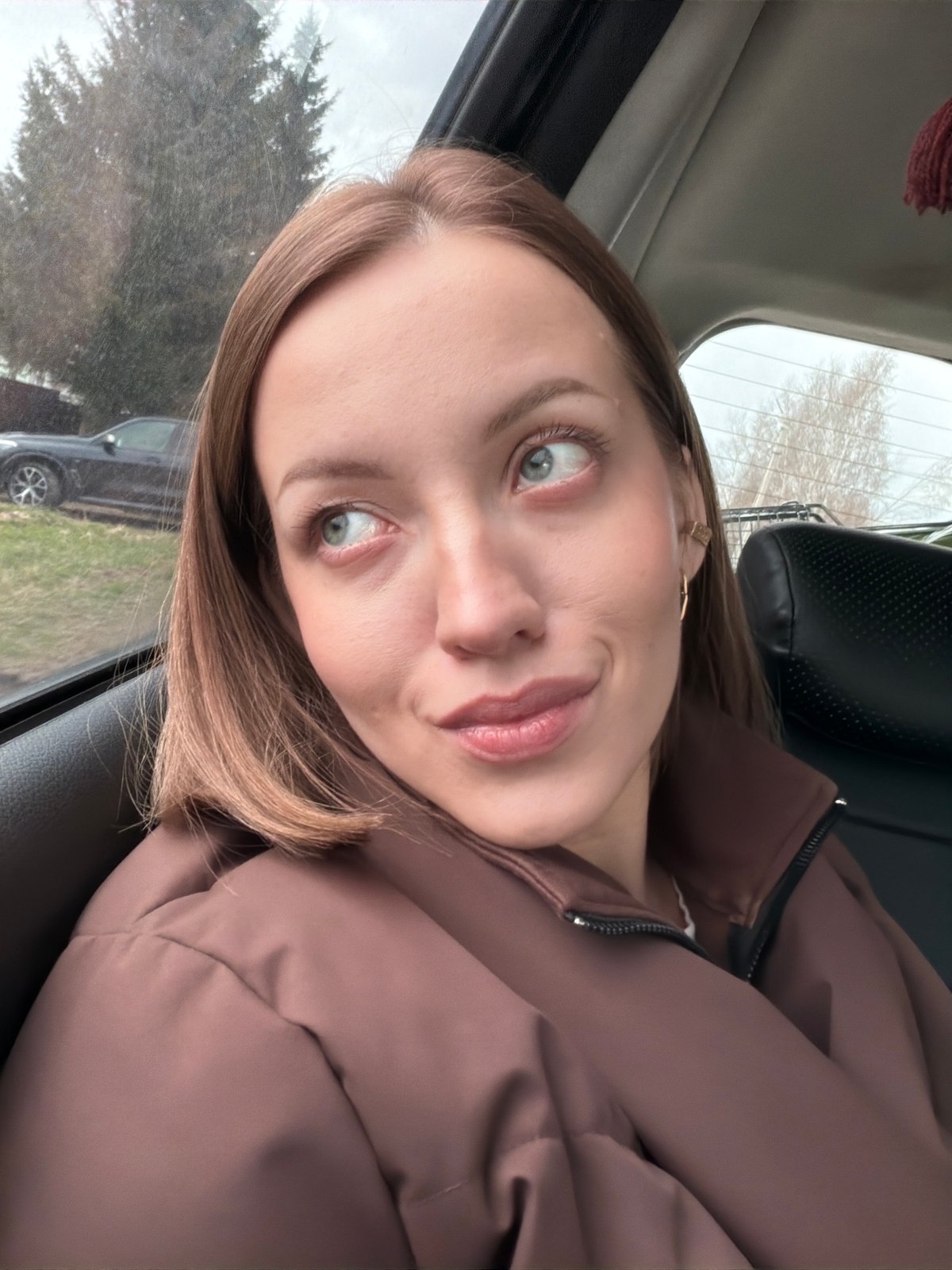Woman Takes Selfie in Car in Раздолье, Russia