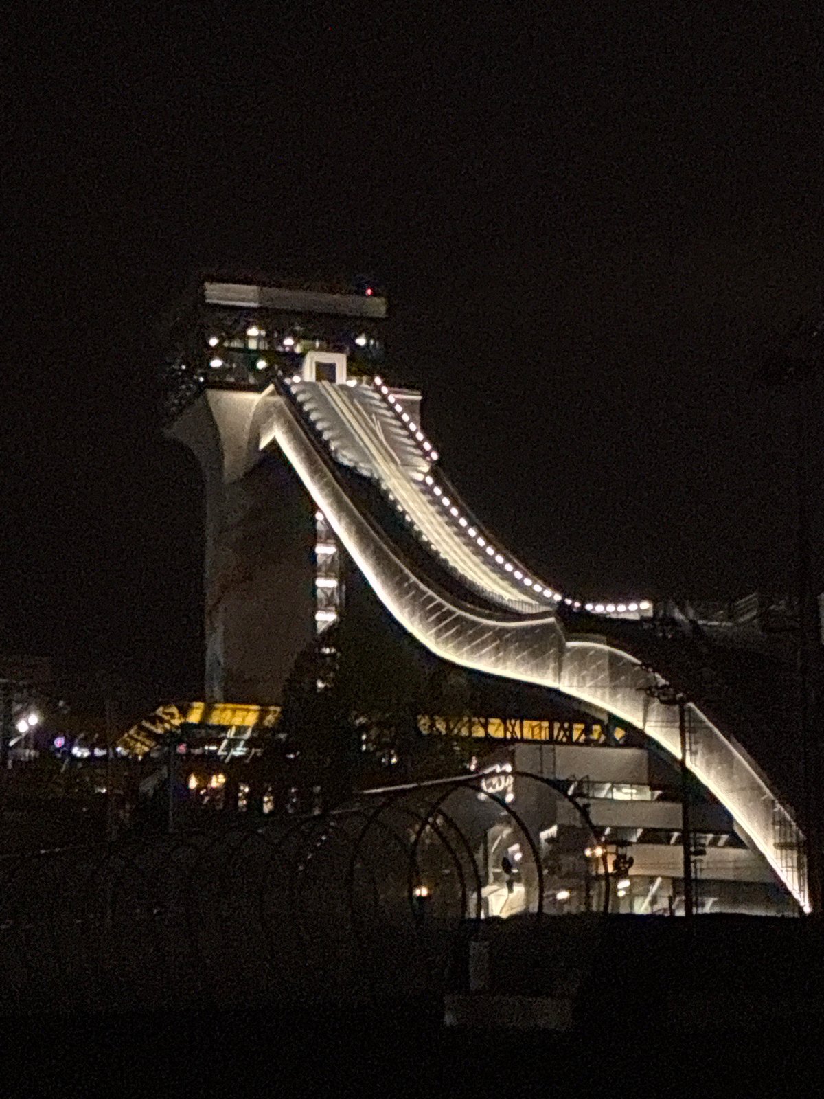 Illuminated modern bridge captured at night in Moscow