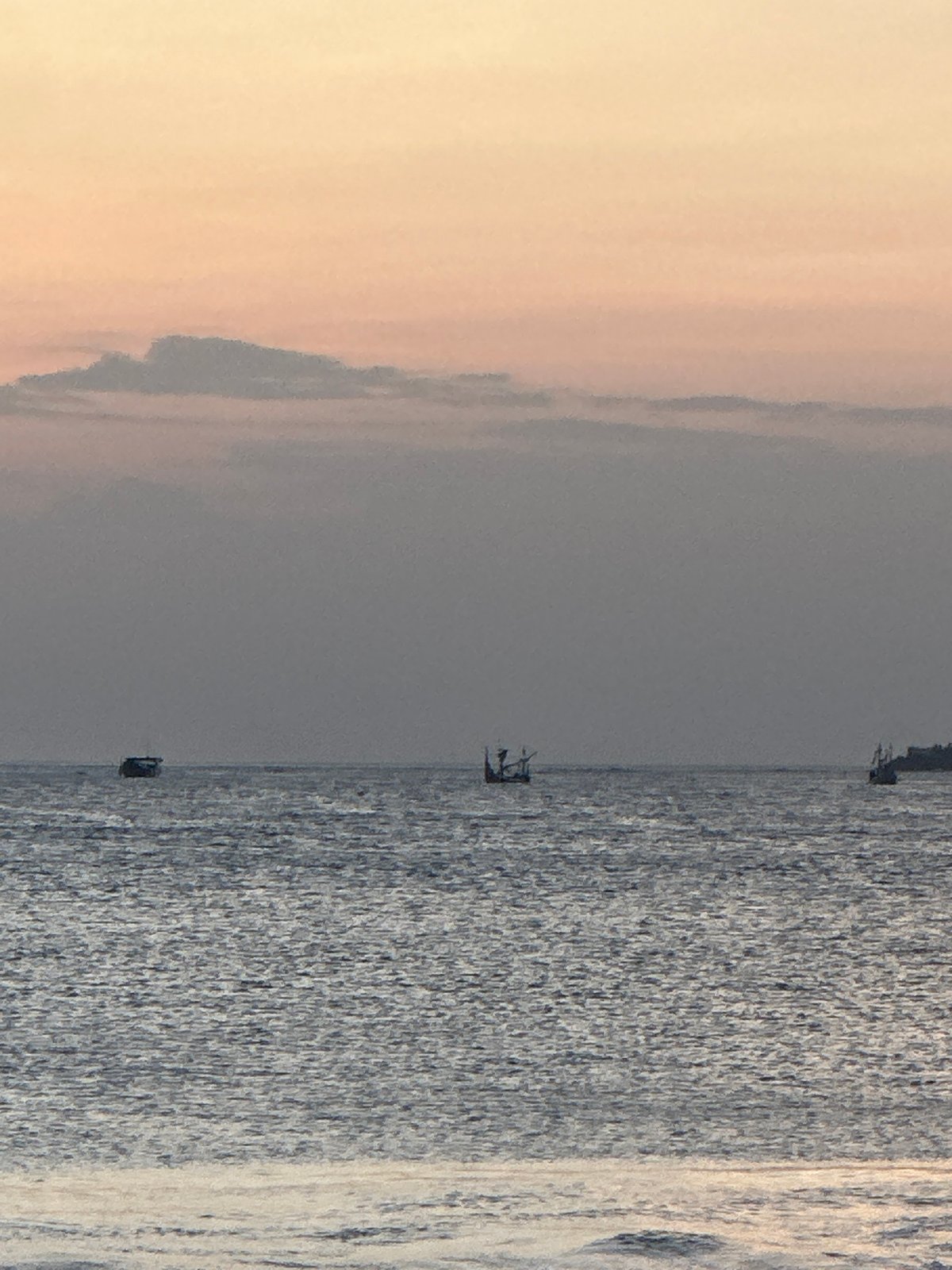 Sunset session on Kuta Beach with dogs, boats, and good light