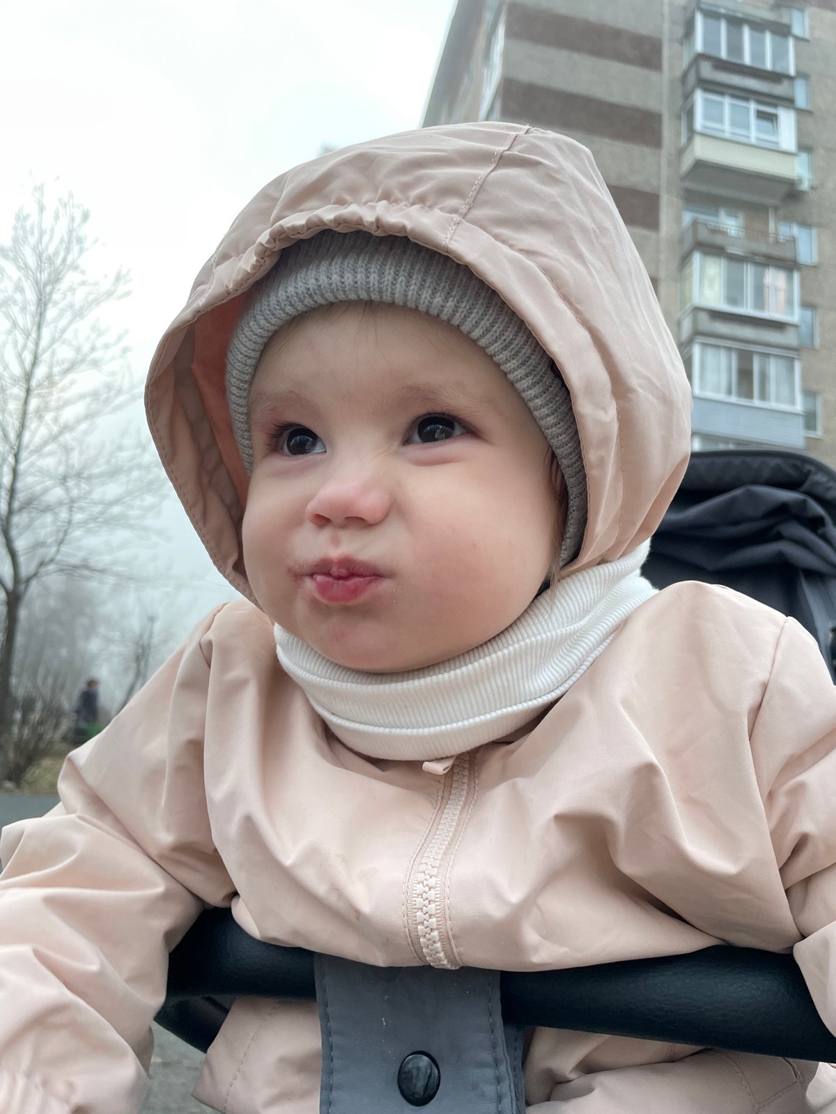 Parent and child enjoy foggy afternoon at Izhevsk playground
