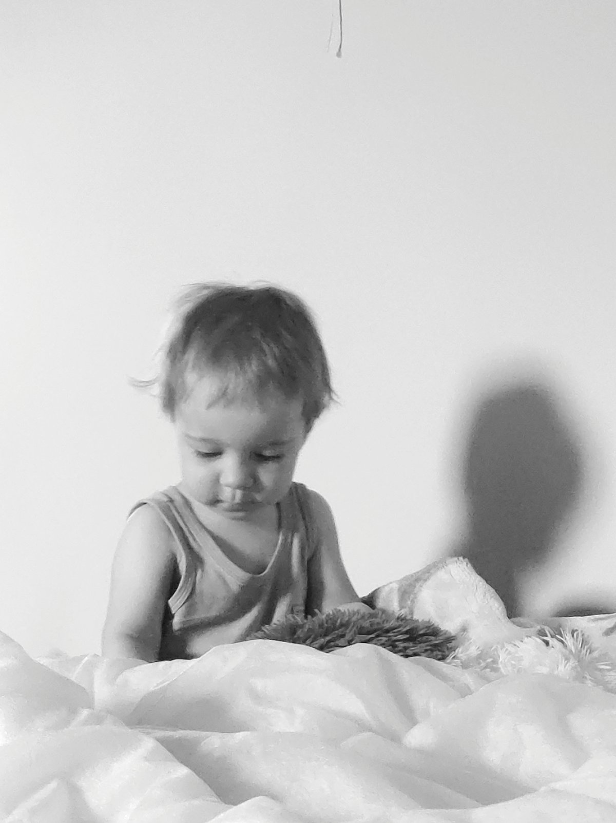 Child photographed in bedroom during early morning hours