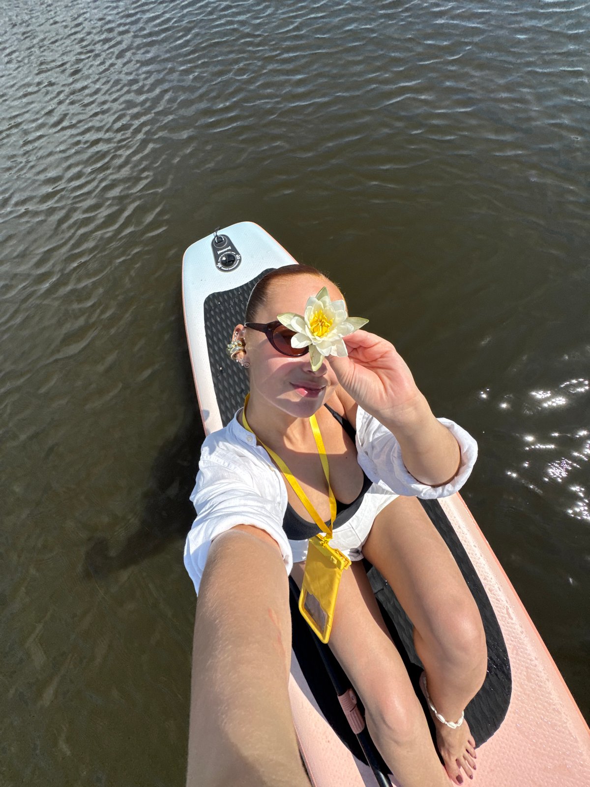 Lazy summer morning on a paddleboard, lake near Chastyye