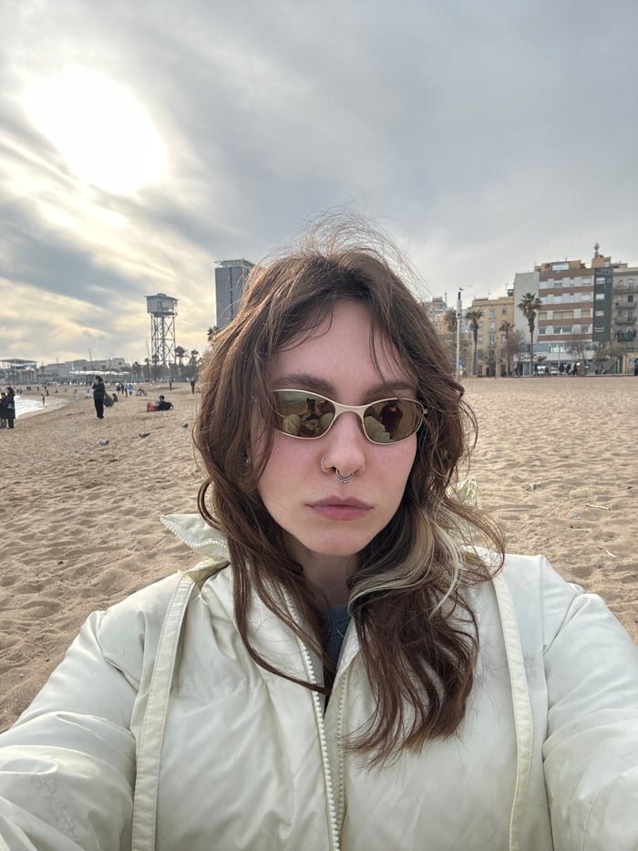 Beachgoers enjoy afternoon leisure time at Barcelona's Barceloneta Beach