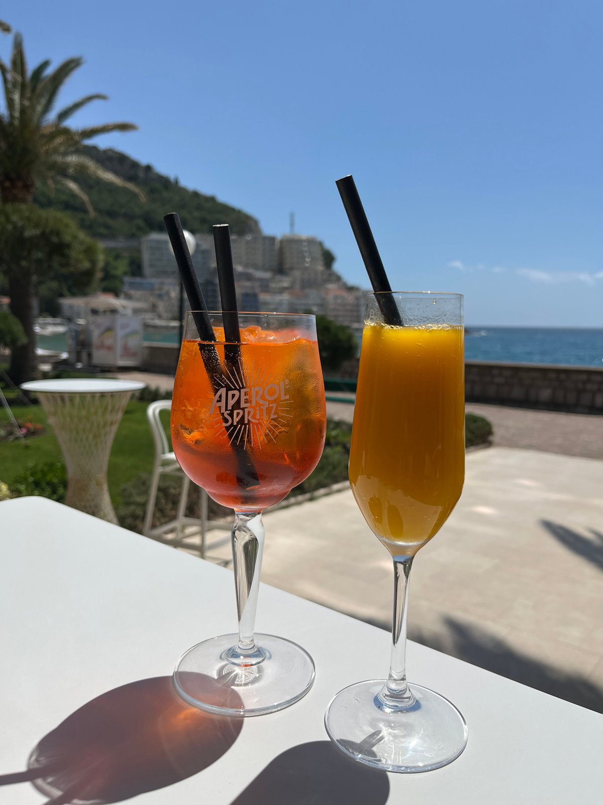 Cocktails enjoyed with scenic coastal view in Bečići, Montenegro