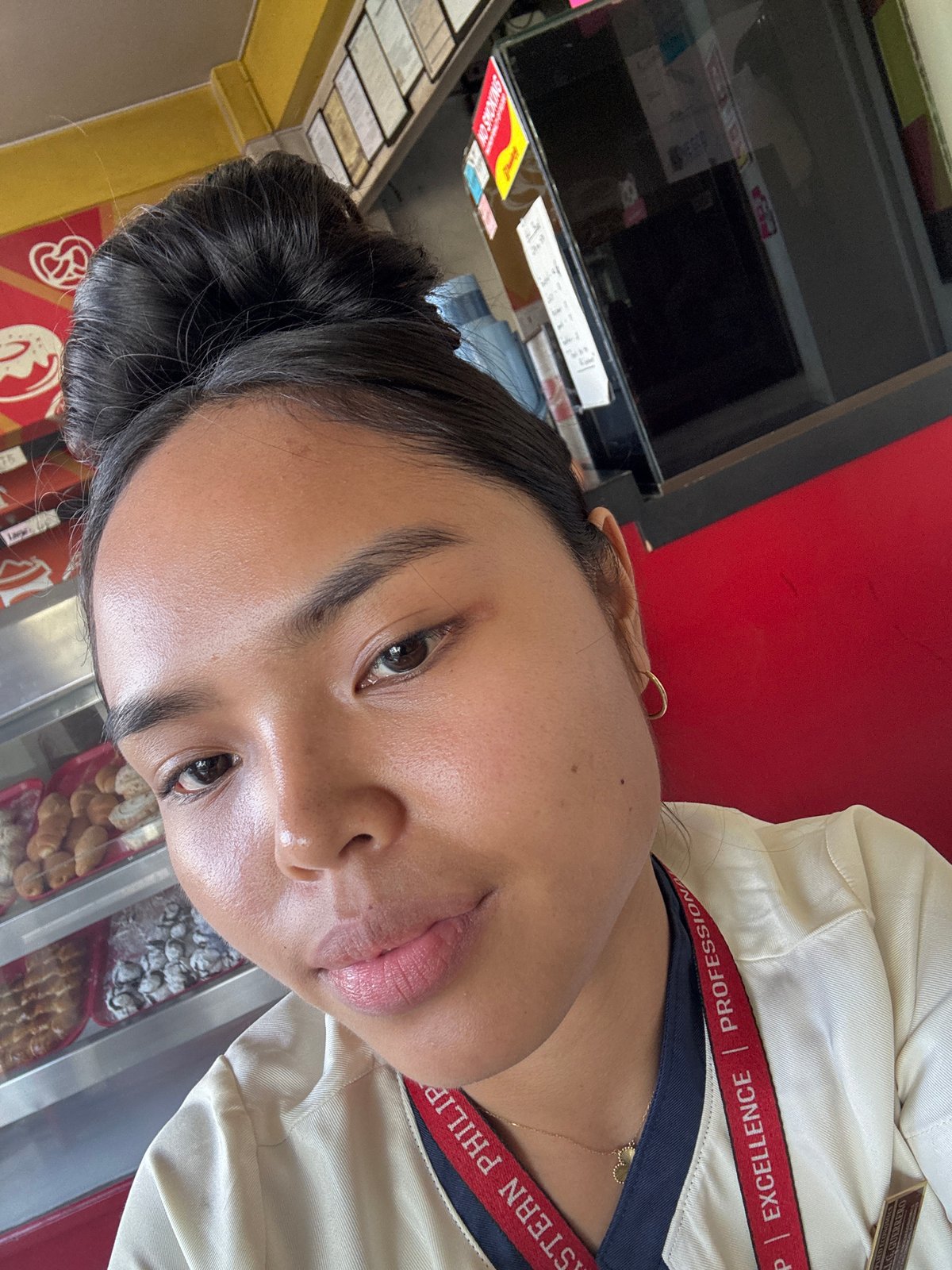Selfie series at a Davao café, USeP lanyard in frame