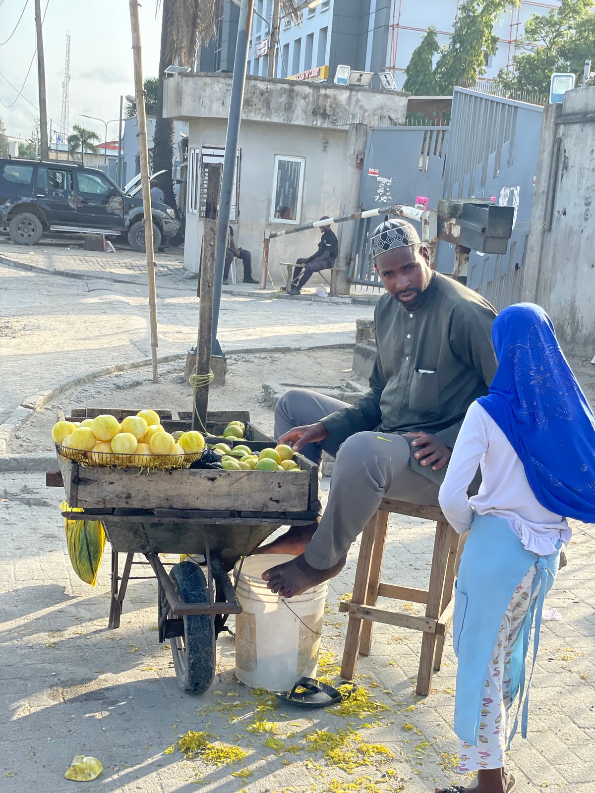 Roadside commerce and daily movement along a Lekki street