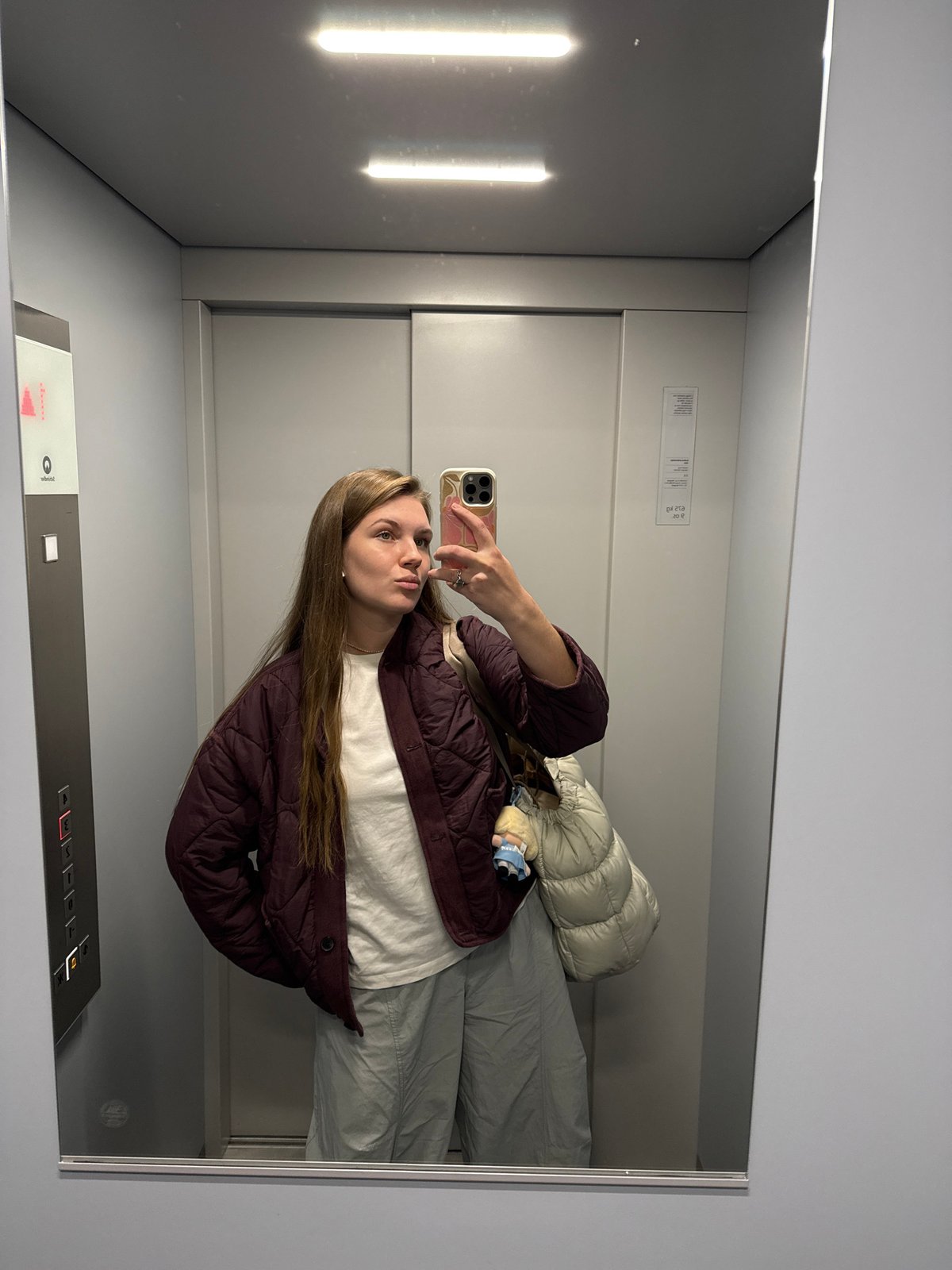 Woman Takes Mirror Selfie in Belgrade Elevator