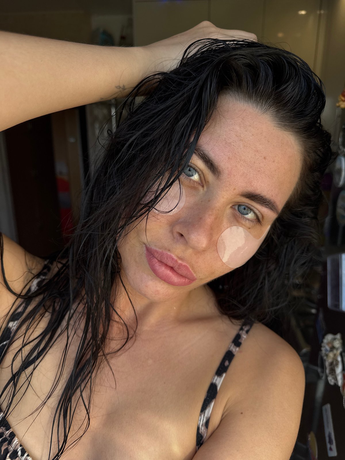 Woman photographed in bed during early morning hours in Chaikovsky