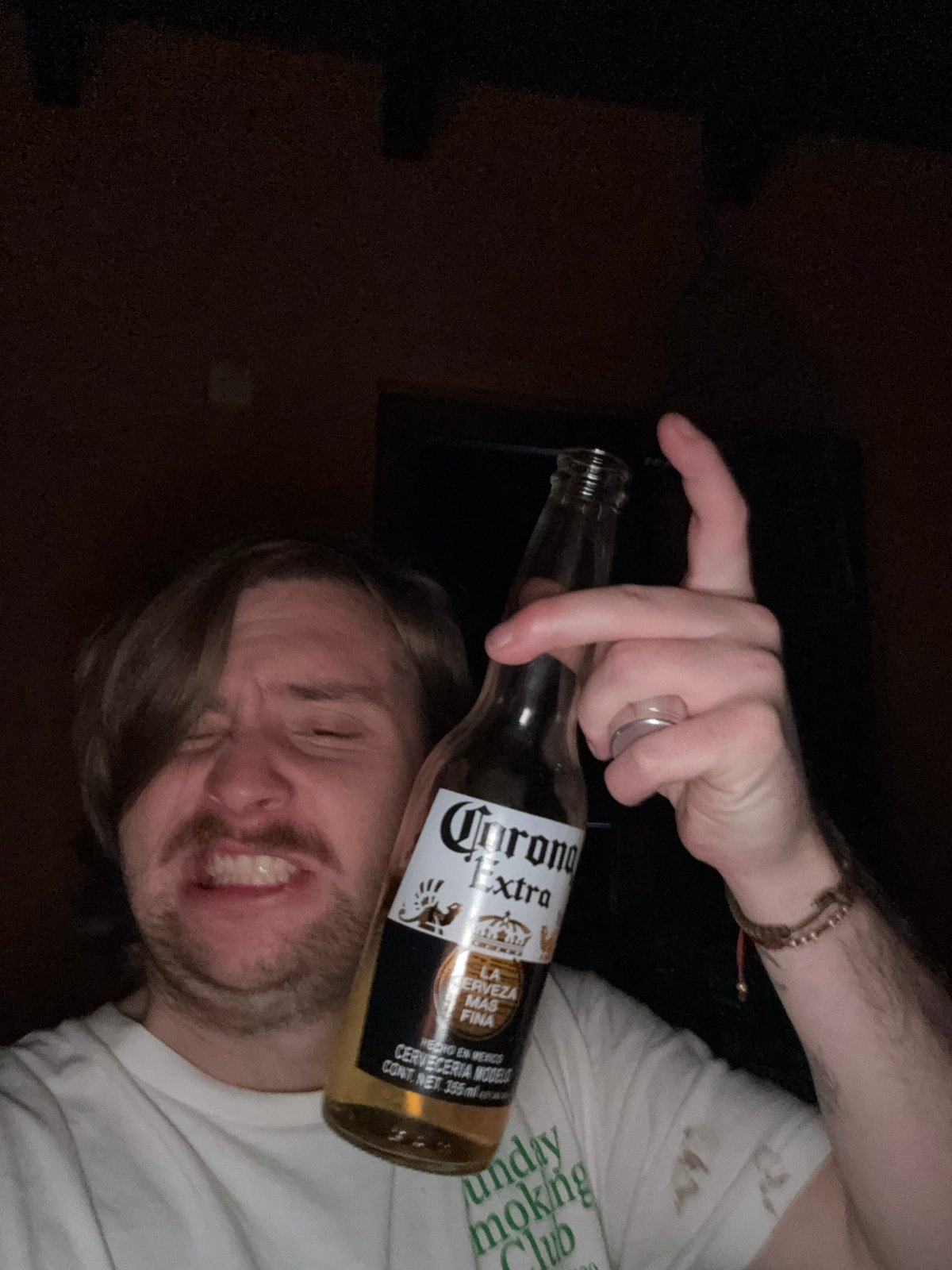 Person drinks Corona, takes selfies in Mexican home
