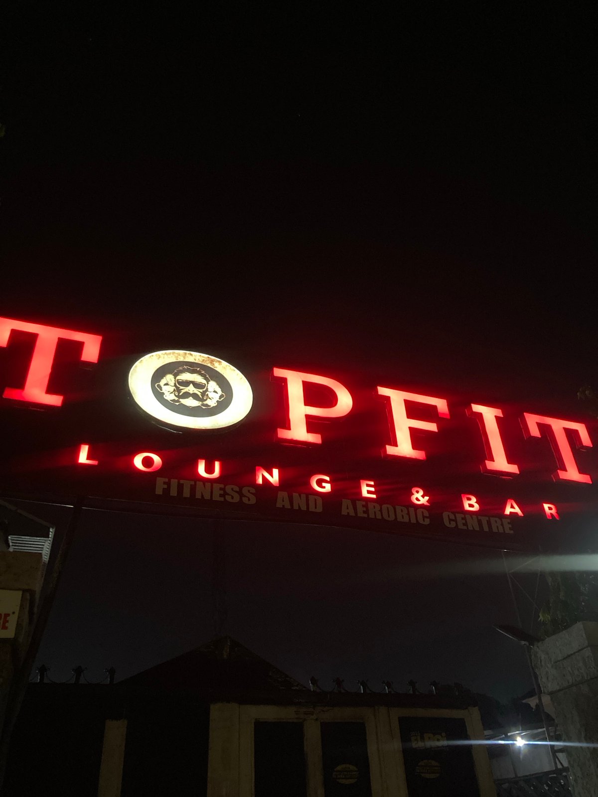 Neon-lit nightlife outside a Gwarinpa lounge bar