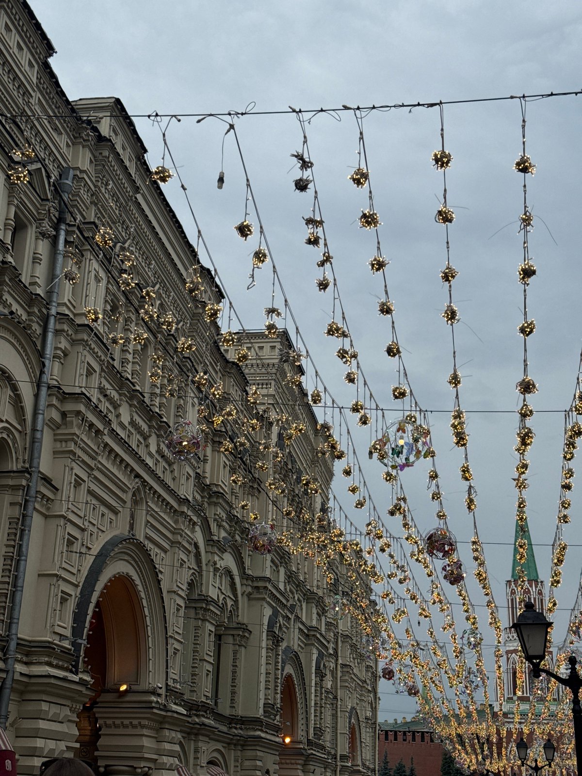 Ornate street lighting and festive decorations in a European urban setting