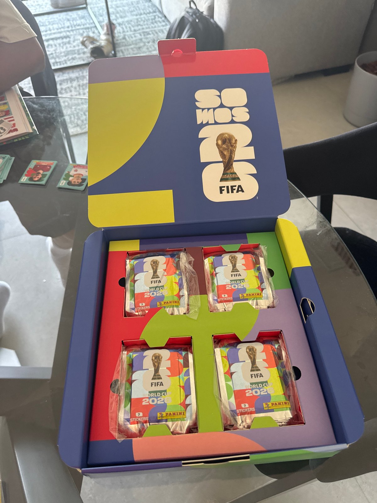 Soccer fan opens World Cup sticker packs in León