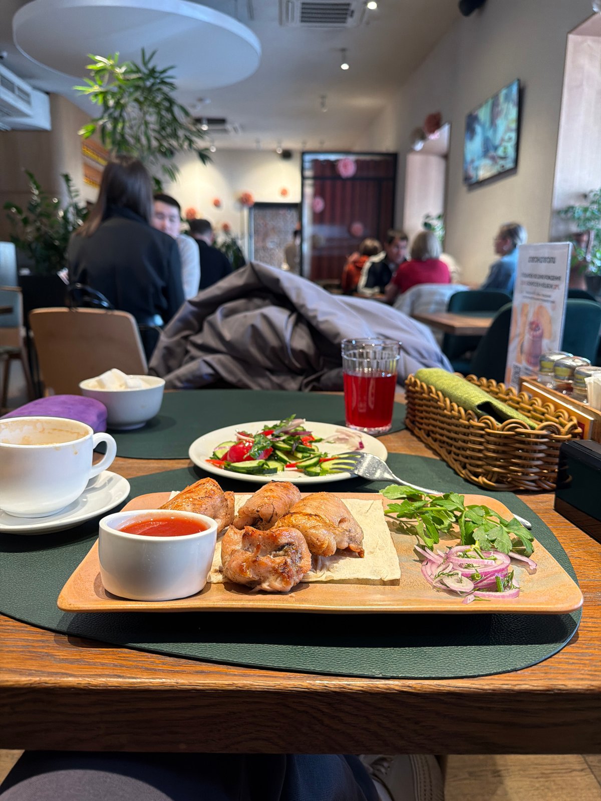 Diner documents restaurant meal and camera in Moscow