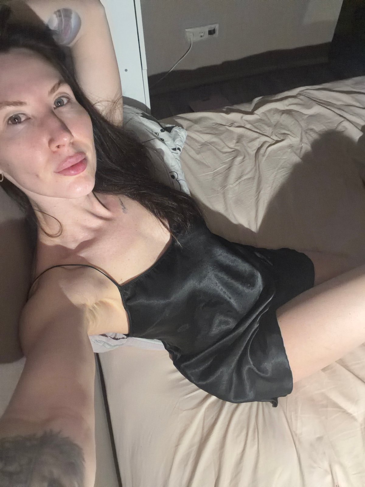 Woman in nightgown observed on bed in Perm
