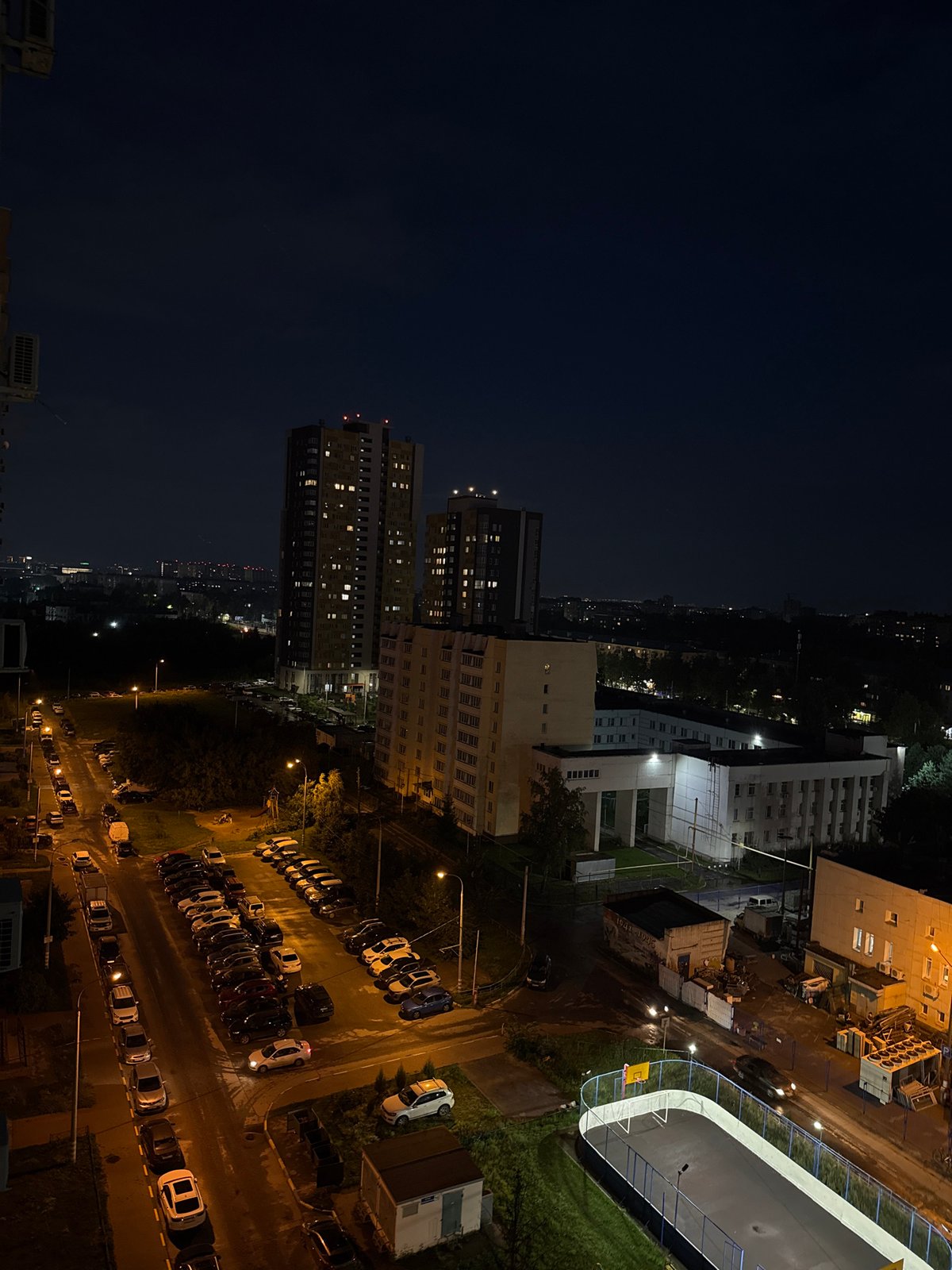 Night views from a Nizhny Novgorod high-rise, court games below