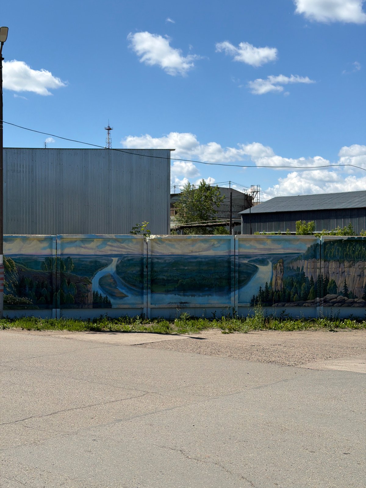 Landscape mural spotted on fence in Chaikovsky, Russia