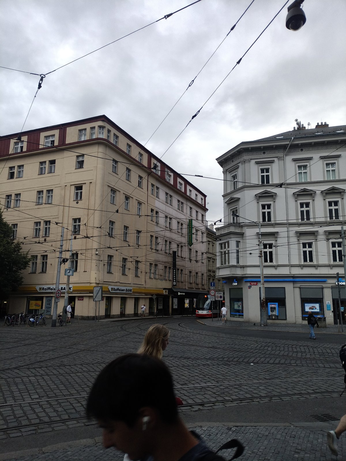 Trams and cobblestones on a cloudy Prague afternoon