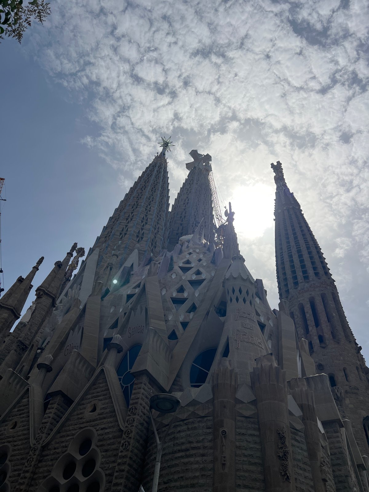 Sagrada Família spires and street music on a Barcelona morning