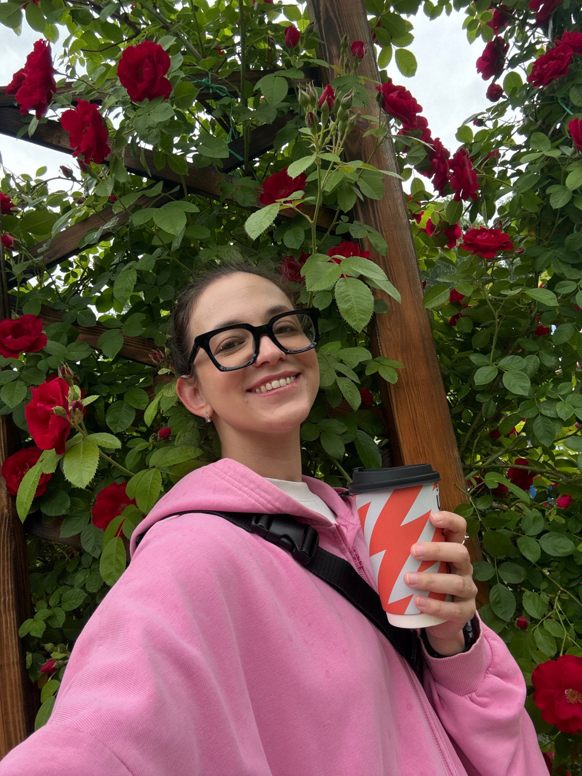 Coffee and roses at a pergola in Chaikovsky, summer morning