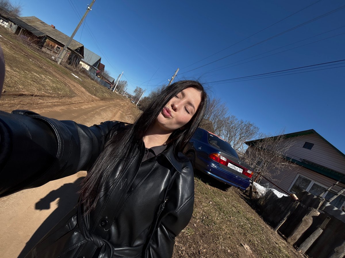 Morning scenes captured in Фоки: woman by car, parent with stroller