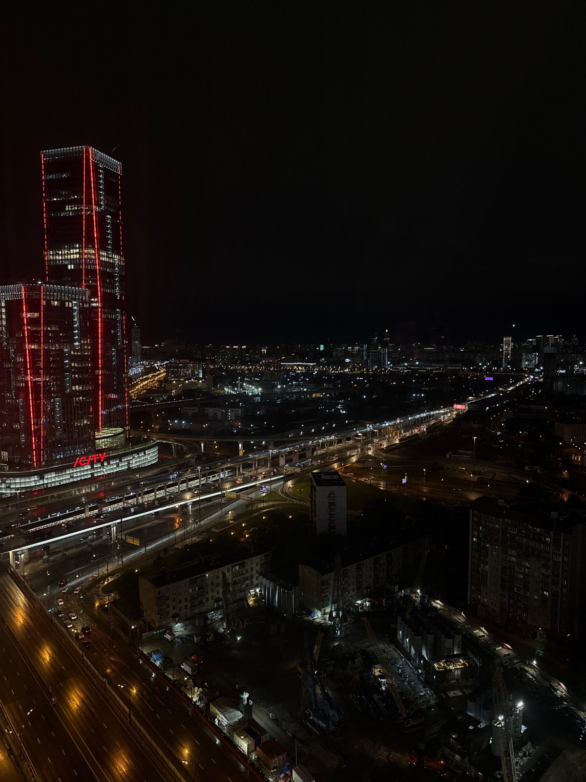 Nighttime cityscape observed from elevated vantage point