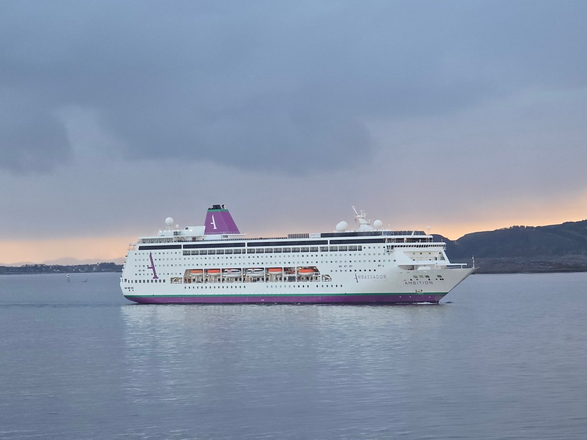Cruise ship Ambassador Ambition sails past Randaberg during sunset