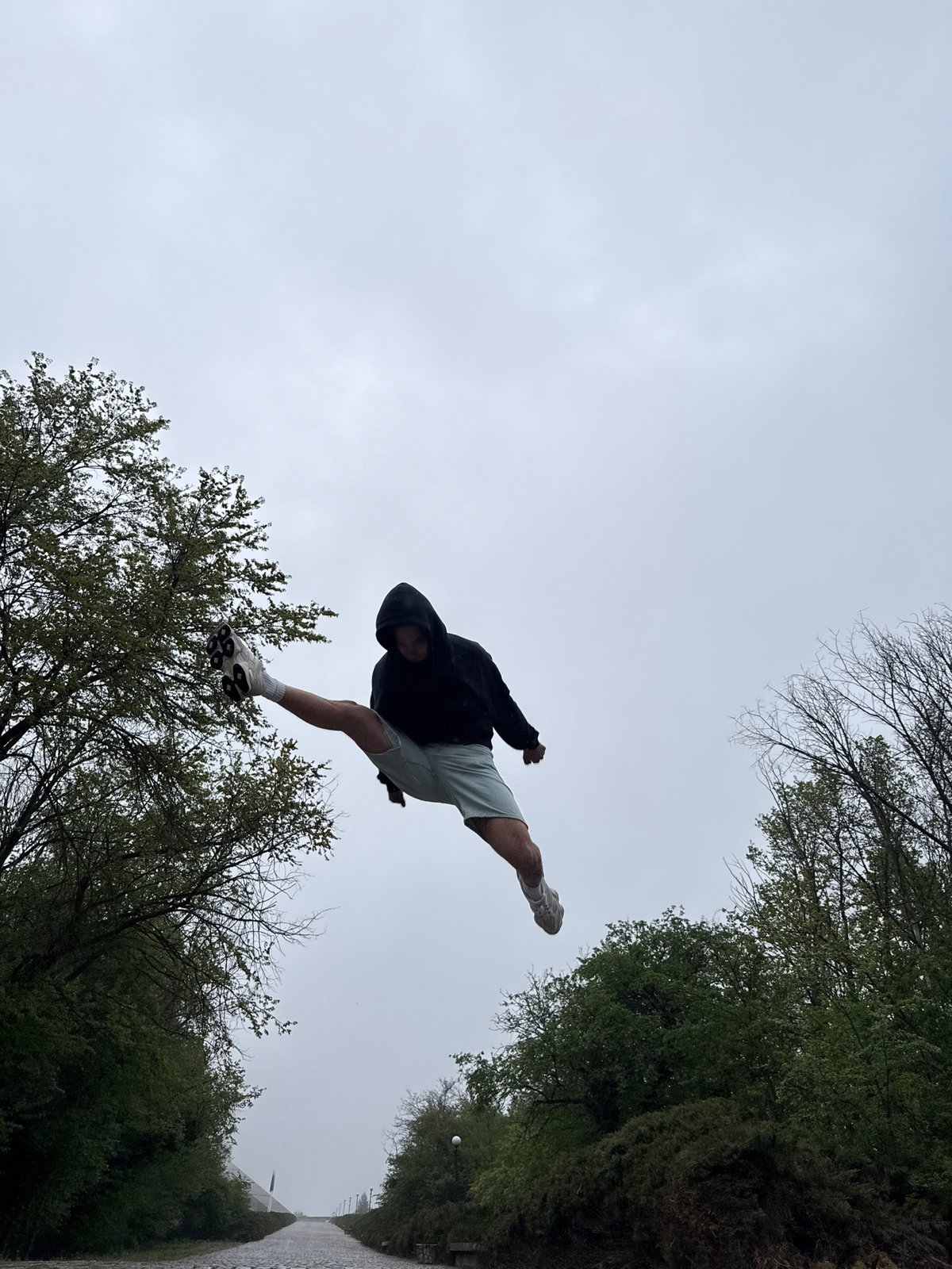 Person jumps, plays ball on Shumen streets during afternoon