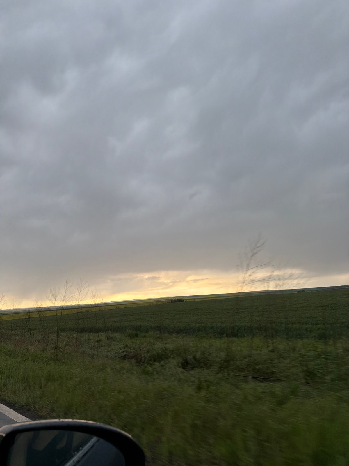 Driver captures rural Bulgarian landscape during afternoon journey