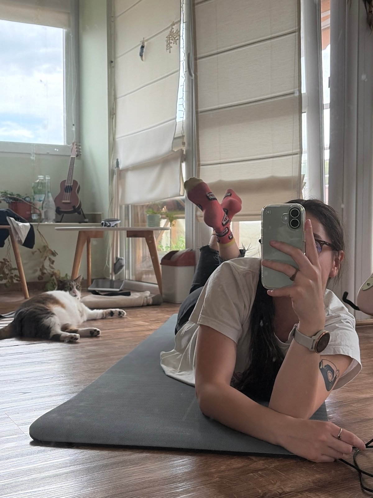 Person and tabby cat share quiet indoor moments