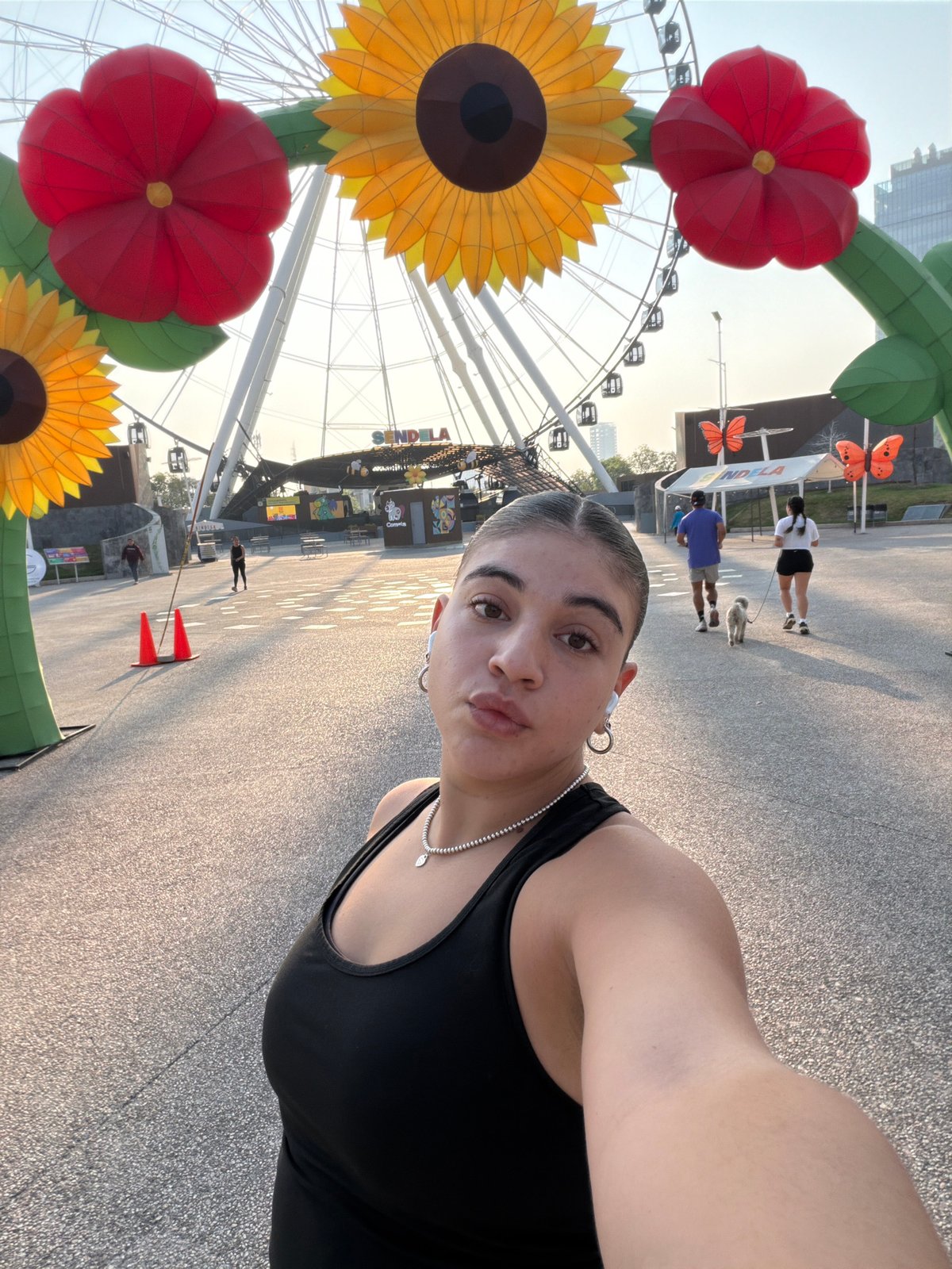 Tourist visits Puebla Ferris wheel, enjoys café drinks during afternoon