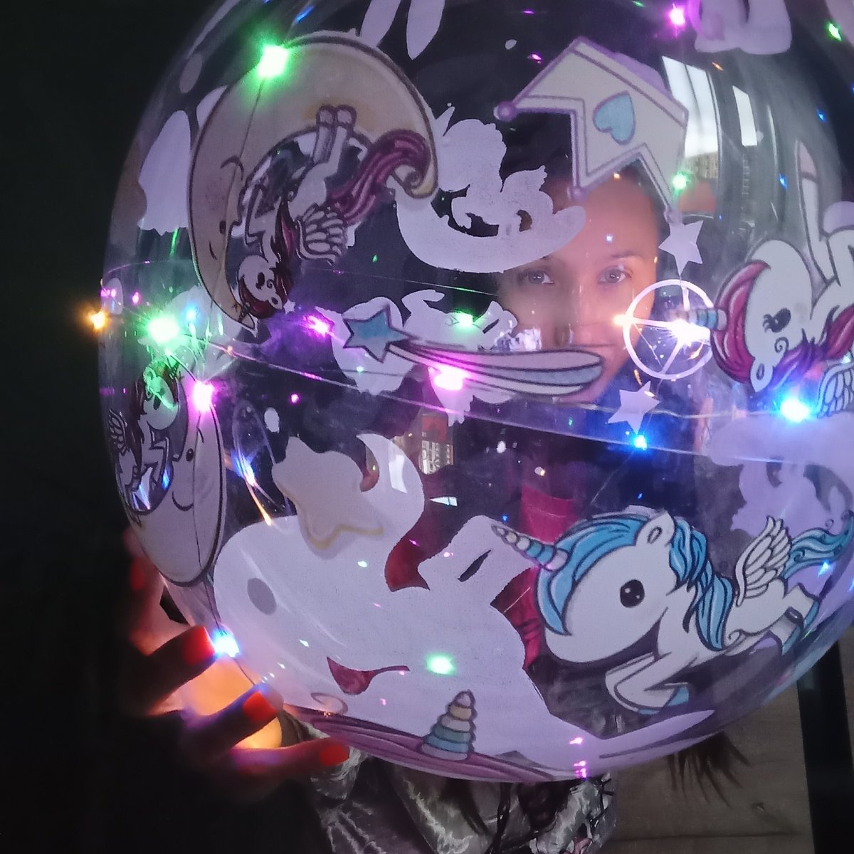 Woman plays with LED lights in Pervomaysky, Russia