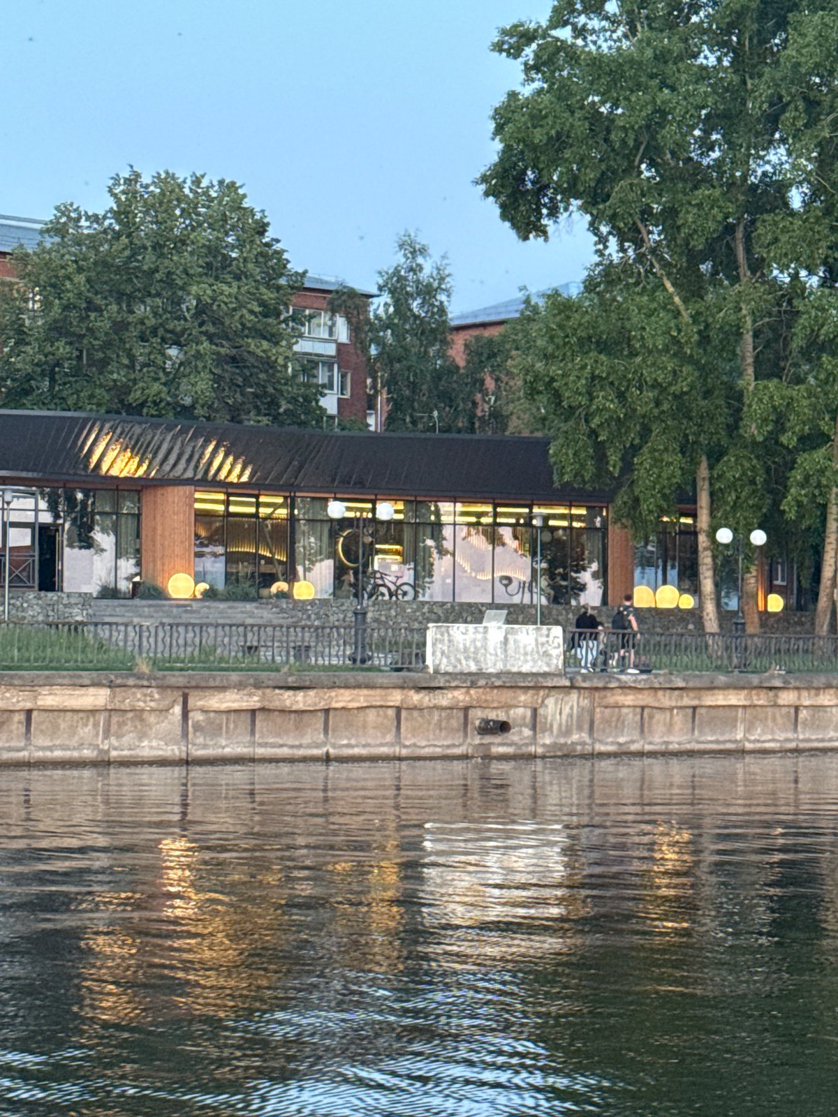 Evening waterfront leisure captured at Votkinsk Reservoir complex