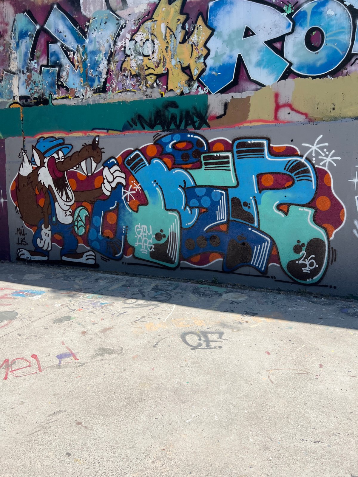 Barcelona skatepark walls covered in layered graffiti and murals
