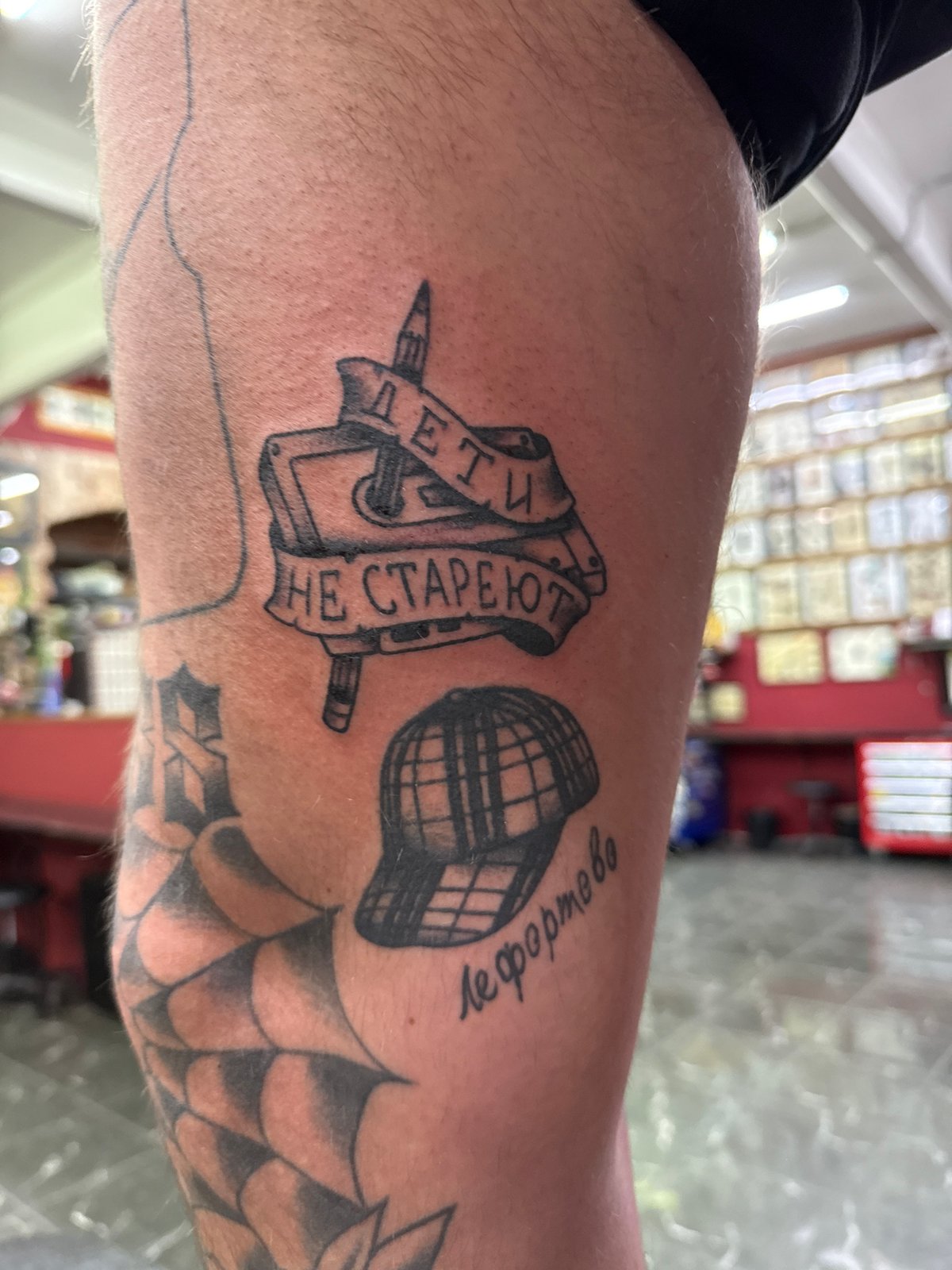 Tattoo session documented in Moscow studio showcases multiple arm designs
