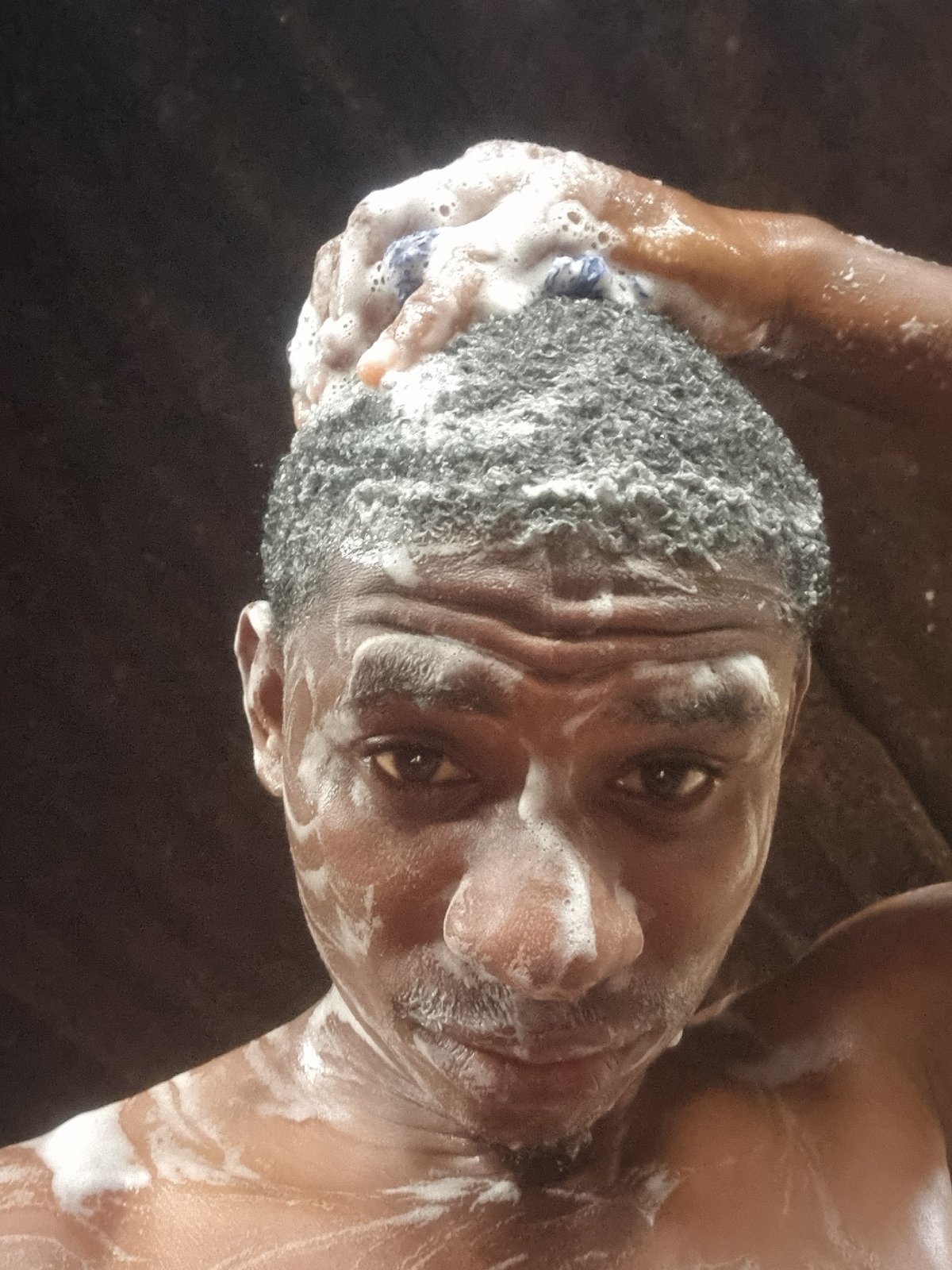 Man photographed washing with soap in Onitsha Nigeria