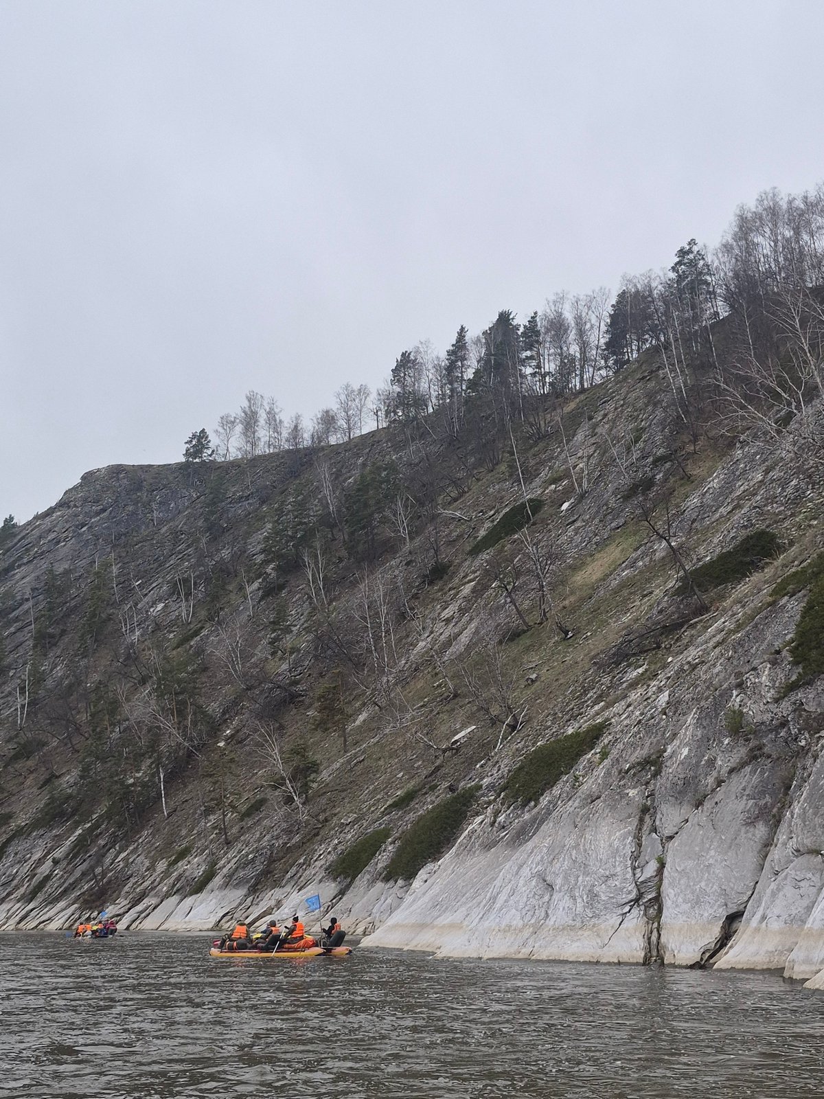 River boating documented near Russian cliffs in overcast conditions