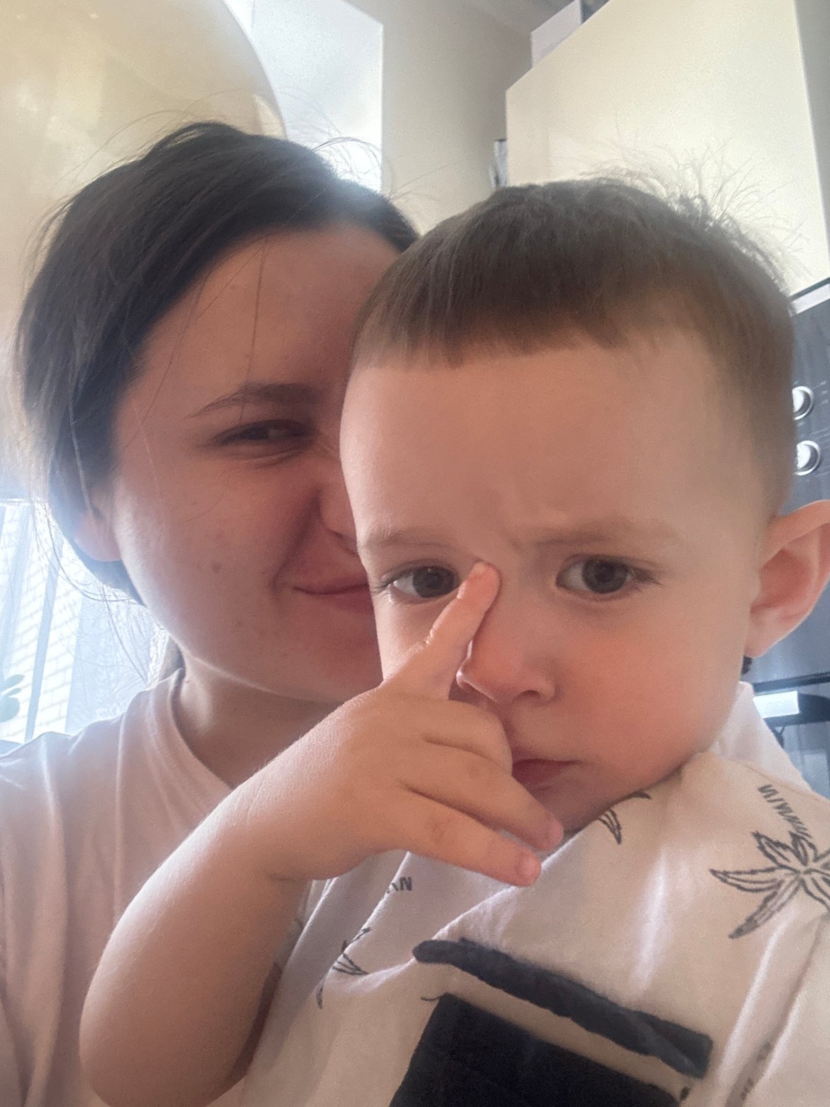 Mother and child share quiet morning moments in Russian suburb