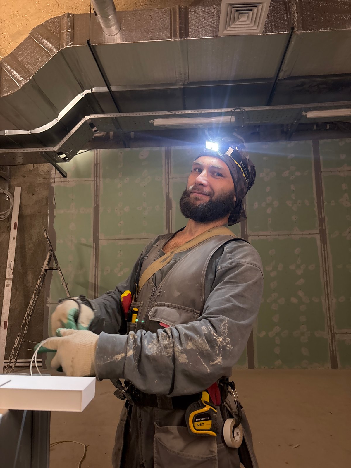 Construction worker performs indoor renovation in Moscow