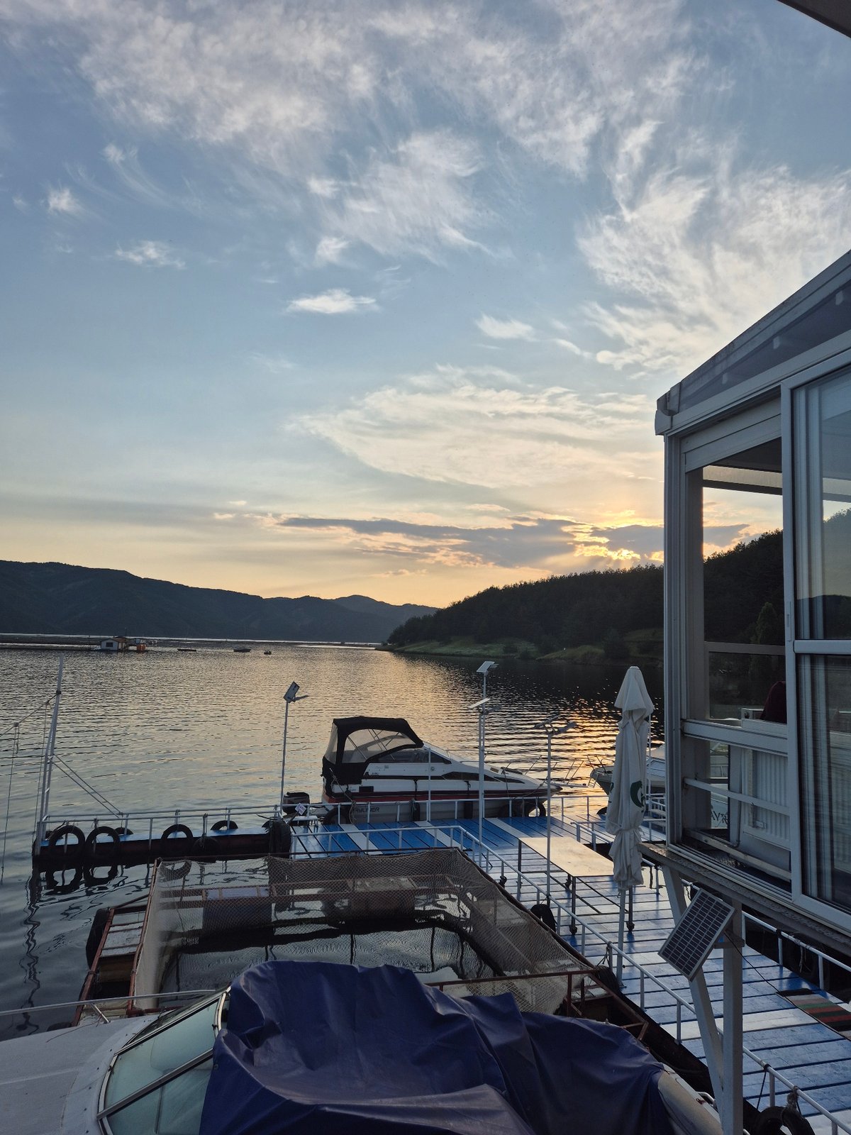 Sunset lakeside dining captured in Brosh, Bulgaria